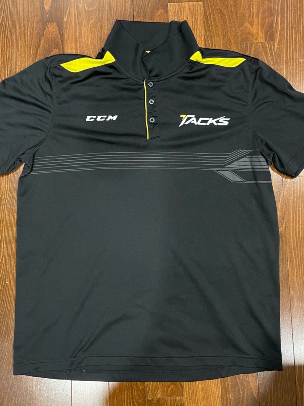 CCM Black Polo with Yellow Accent Tacks Logo